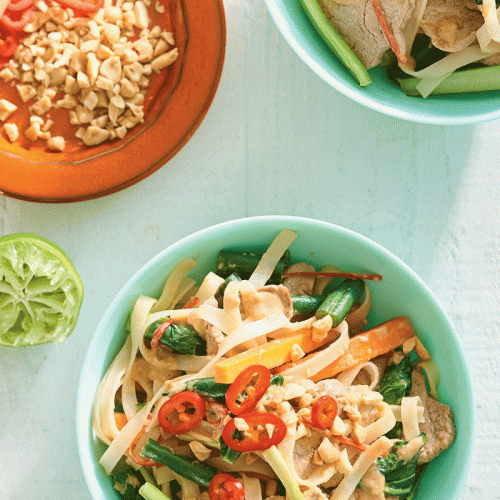 Stir-fried pork with rice noodles, peanuts and choy sum