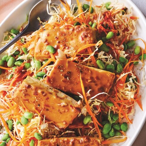 Baked tofu with satay sauce, edamame and kimchi slaw