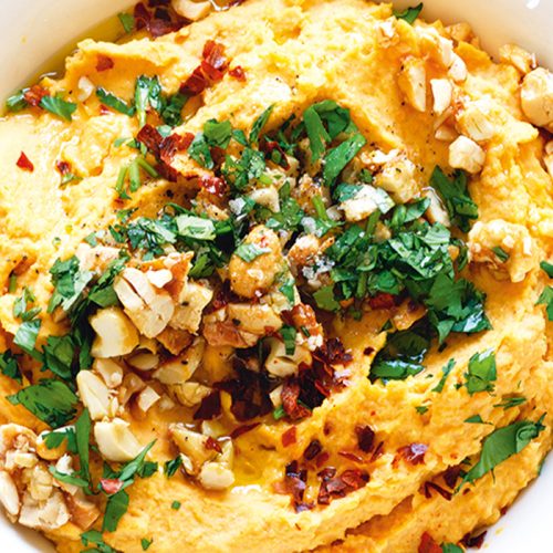 Vegan cashew-topped sweet potato hummus