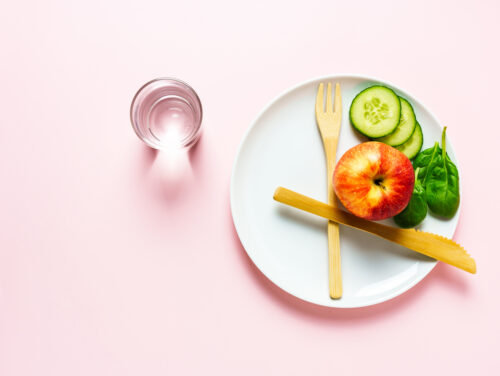 A plate of food resembling a clock to suggest intermittent fasting