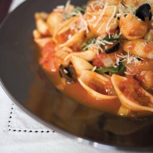 Spinach and black olive sauce with pasta