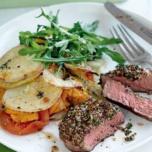 Mustard steaks with layered vegetable bake