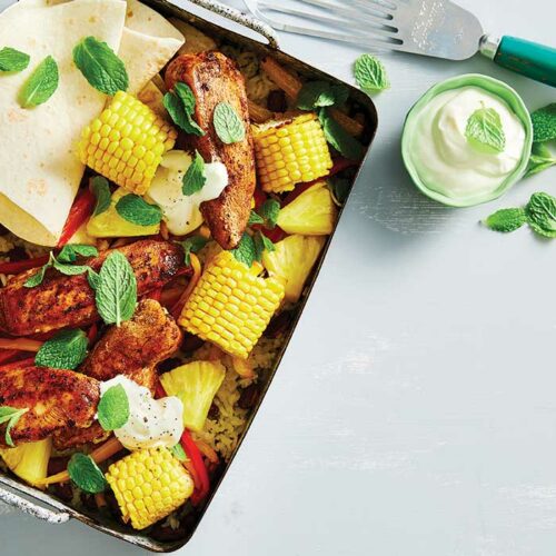 Sticky jerk chicken, rice and bean traybake